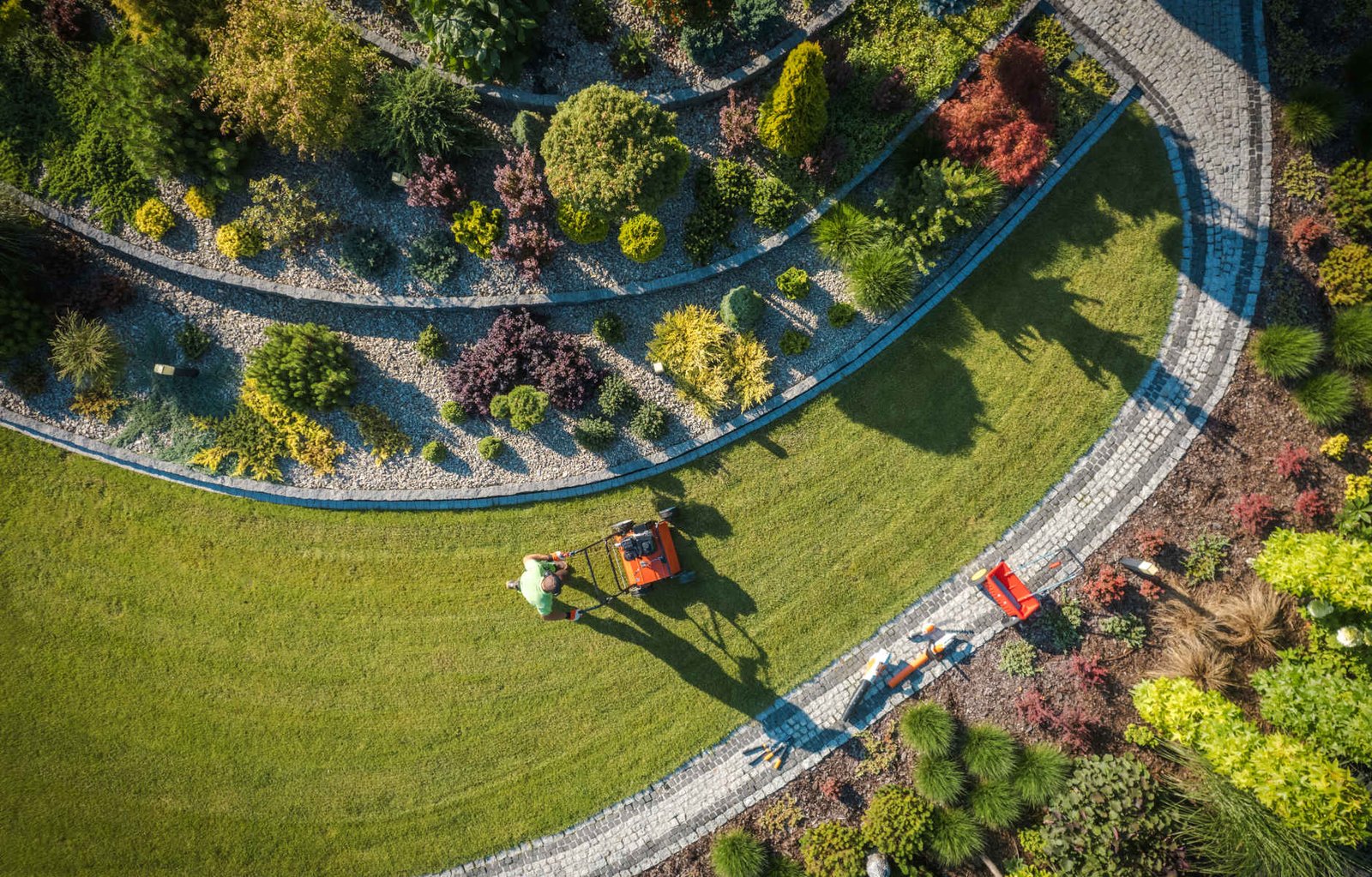 Professional garden worker maintaining landscape